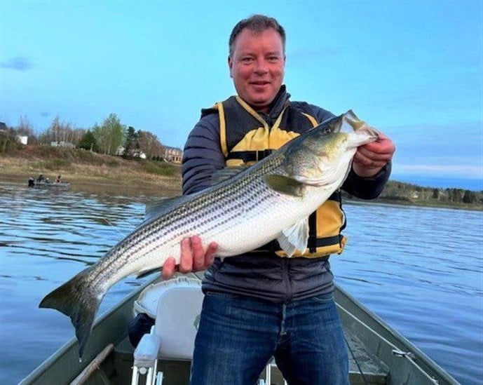 Benjamin Hadfield came from Scotland to catch this nice striper.  Country Haven photo
